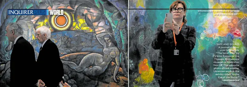  ?? —PHOTOS BY AFP ?? SAFE AND SOUND A journalist takes a picture beside “The 1st of May” by Viktor Palmov at the Thyssen-Bornemisza museum in Madrid on Nov. 28. The opposite photo shows another Ukrainian work at the exhibit titled “In the Eye of the Storm.”