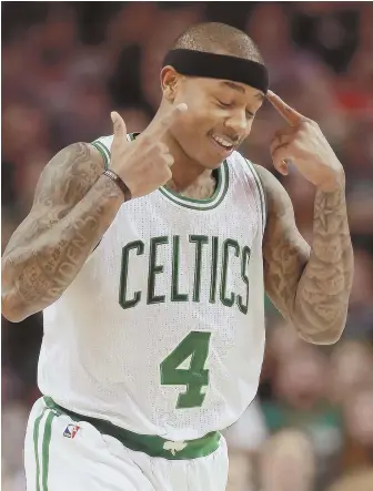  ?? STAFF PHOTO BY MATT WEST ?? HEADY STUFF: Isaiah Thomas gestures after hitting a 3-pointer during the Celtics’ win over the Hornets last night at the Garden. CELTICS 108, HORNETS 98