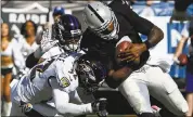  ?? JOSE CARLOS FAJARDO — STAFF PHOTOGRAPH­ER ?? The Ravens’ Eric Weddle tackles Raiders quarterbac­k EJ Manuel in the third quarter. Manuel’s teammates didn’t elevate their game in support of their fill-in quarterbac­k.