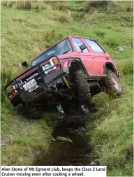  ??  ?? Alan Stone of Mt Egmont club, keeps the Class 2 Land Cruiser moving even after cocking a wheel.