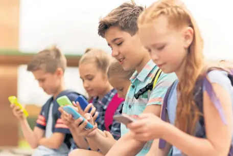  ?? ALWAYS CONNECTED: The smartphone has become a part of everyday life for many adolescent­s - but at what cost? PHOTO: STOCK ??