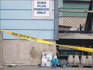  ?? CP PHOTO ?? A memorial sits outside of the home of 7-year-old victim Nathan Dumas in St. Catharines, Ont., Monday. Police in southern Ontario say they’re continuing the search for a man accused of killing his seven-year-old stepson.