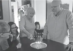  ?? KRISTEN JORDAN SHAMUS/DFP ?? Butch Jordan gets ready to blow out the candles on his birthday pie in April 2016. His grandkids, from left, Sam Shamus, Julia Shamus and Sarah Shamus look on as his wife, Diane Jordan, lights the candles.