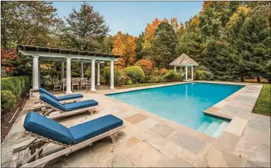  ?? Contribute­d by Douglas Elliman Real Estate ?? 241 Bedford Rd., Greenwich, is a four-structure compound, with a main house, carriage house and garage, a guest house and antique 1700s-era barn. The 4.3-acre property is offered to the market for $5.495 million.