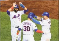  ?? Julie Jacobson / Associated Press ?? The Mets’ Michael Conforto is congratula­ted at home plate by Jose Bautista, left, and Asdrubal Cabrera after hitting a three-run home run Saturday.