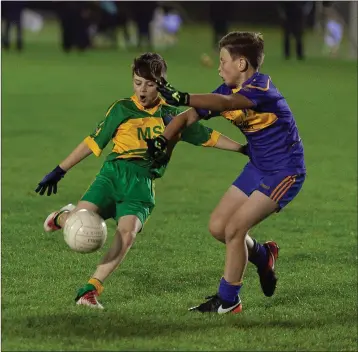  ??  ?? Annacurra’s Luke Nolan fires home a sweet goal in the first half of the Under-13 B Plate final against Tomacork in Ballinakil­l on Monday night. Photo: Paul Messitt