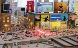  ?? Mary Altaffer photos / Associated Press ?? How meta: Times Square is depicted in the Gulliver’s Gate exhibit, an indoor 49,000-square-foot diorama of world landmarks opening near Times Square.