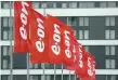  ?? — Reuters ?? Flags of E.ON are seen before the annual meeting of German utility giant E.ON in Essen, Germany.