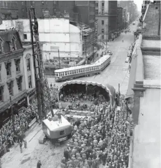  ?? JOHN WALKER PHOTO ?? Crowds gather to watch as constructi­on of the Yonge subway, funded largely by farebox surpluses, begins in 1949. Ten years later, Toronto was eager to get building again.