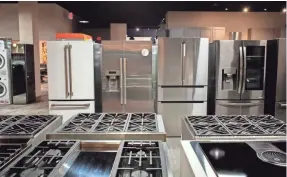  ?? ADAM CAIRNS/COLUMBUS DISPATCH ?? Appliances with uncommon finishes, such as matte white, left, shown here at Custom Distributo­rs, have been hard to get.