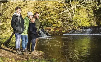  ??  ?? TOP A stand of Scots pine on Otter Head keeps watch over the mouth of the River Otter ABOVE Pete and family scan the water for playful otters and those elusive beavers