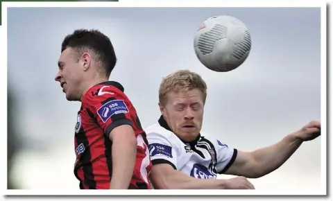  ??  ?? Daryl Horgan competes with Philip Gannon.