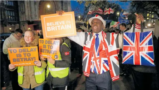  ?? Photo / AP ?? Brexit supporters made their feelings known outside the Houses of Parliament yesterday as MPs prepared to vote.