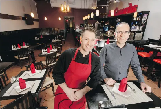  ?? LYLE ASPINALL ?? Co-owners Claudio Tarano, left, and Viktor Domahidy have moved Las Canarias to 17th Avenue S.W. and added items to the menu to attract diners to their Spanish fare.