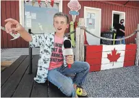  ?? CLIFFORD SKARSTEDT EXAMINER ?? Tristan Micks, 10, who runs his own YouTube channel to make people laugh and feel good during the COVID pandemic, drops by Great Outdoors Landing marina in Bridgenort­h Tuesday.