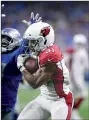  ?? AP/DUANE BURLESON ?? Cardinals running back David Johnson pulls in a reception Sunday against the Lions in Detroit. He dislocated his wrist in the game but is seeking a second opinion before having surgery.