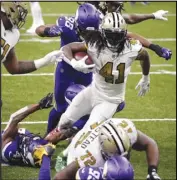  ?? Associated Press ?? TD MACHINE
New Orleans Saints running back Alvin Kamara (41) carries for his fifth touchdown of the game, in the second half against the Minnesota Vikings in New Orleans on Friday. Kamara scored six touchdowns in the Saints 52-33 win.