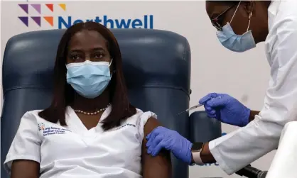  ??  ?? Sandra Lindsay, a nurse at Long Island Jewish medical center, was the first patient to be given the Pfizer vaccine, in December last week. Photograph: Mark Lennihan/AFP/Getty Images