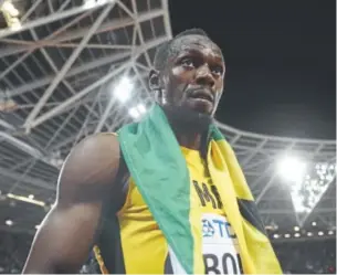  ?? Michael Steele, Getty Images ?? Jamaican star Usain Bolt reacts Saturday night to finishing third in the men’s 100 meters at the world championsh­ips of track and field in London.