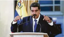  ?? Carlos Becerra / Bloomberg ?? Venezuela President Nicolas Maduro insisted there was no crisis even as power went out twice during his news conference.