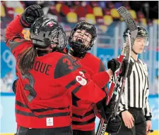  ?? BRUCE BENNETT GETTY IMAGES FILE PHOTO ?? Sarah Nurse of Team Canada is congratula­ted by Erin Ambrose and Jocelyne Larocque after scoring a goal against Team Finland at the Beijing Olympics in February.