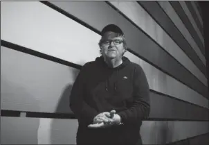  ?? The Associated Press ?? MOORE HUMOR: The Academy Award-winner Michael Moore starring in the one-man show “The Terms of My Surrender,” poses for a portrait Thursday at the Belasco Theatre in New York.