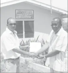  ??  ?? Ricky Roopchand, General Manager, Hope Estate (left) and the contractor, Ivor Allen.