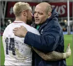  ??  ?? HARD LUCK: Best embraces England’s Jack Nowell on the Lansdowne Road pitch