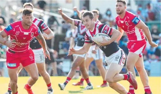  ?? Picture: Jono Searle/Getty Images ?? BIG GAME: Sam Walker of the Sydney Roosters breaks away to score a try against the St George Illawarra Dragons at Clive Berghofer Stadium, which was witnessed by 7800 people,