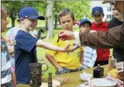  ??  ?? Children participat­e in an educationa­l activity at the Litchfield Historical Society in 2016. The summer sessions resume in July and August; registrati­on is now open.