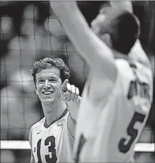  ?? [KYLE ROBERTSON/DISPATCH] ?? Ohio State’s Miles Johnson, left, celebrates with teammate Christy Blough during a semifinal victory over Hawaii on Saturday. The Buckeyes will play for their third national championsh­ip since 2011 tonight.