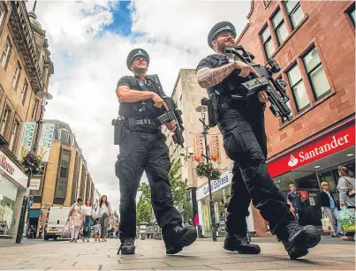 ?? Picture: Steve MacDougall. ?? Armed police on High Street in Perth.