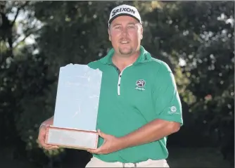  ?? PICTURE: SUNSHINE TOUR/GALLO IMAGES ?? TROPHY HUNTER: Jaco Ahlers is golf’s ‘Lion of Africa’ after winning the Cape Town Open after a play-off at Royal Cape Golf Club yesterday to earn himself a place in this week’s Nedbank Challenge at Sun City.