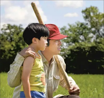  ?? Sundance I nstitute ?? JACOB ( Steven Yeun) and his young son, David ( Alan S. Kim), ponder life on a small farm in rural Arkansas in the new “Minari.”