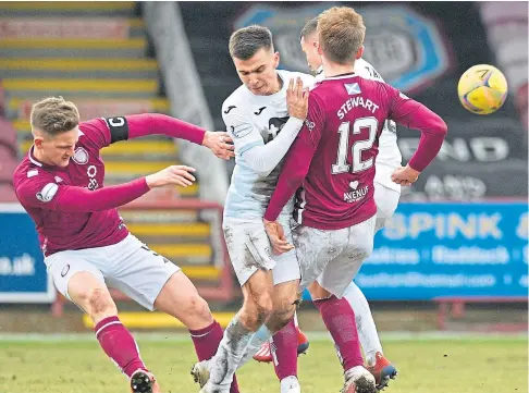  ??  ?? PRESSING GAME: Raith’s Daniel Armstrong is squeezed out by Arbroath pair Thomas O’brien and Scott Stewart.