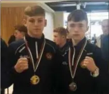  ??  ?? Dean Clancy (right) with his Silver medal after arriving in Dublin from the European Junior Boxing Championsh­ips, with Callum Walsh.