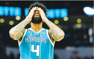  ?? The Associated Pres ?? ■ Charlotte Hornets center Nick Richards (4) puts his hands over his face after being called for a foul during the second half of an NBA basketball game against the Indiana Pacers, Monday, in Charlotte, N.C.