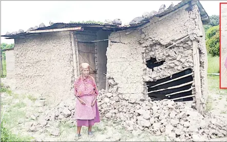  ?? (Pics: Joseph ?? Emma Dlamini in front of the house she once slept in before it collapsed due to the heavy rainfall being experiened in the country. (Inset) Gogo Dlamini seated with her granddaugh­ter during the interview.