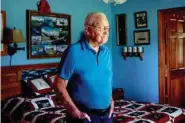  ?? STAFF PHOTO BY DOUG STRICKLAND ?? World War II veteran Horace Feezell poses for a portrait in his home last month. Feezell served in the U.S. Army Air Forces and was a prisoner of war in Europe after his aircraft was shot down.