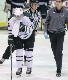  ?? LIAM RICH- ?? Saskatchew­an forward Logan McVeigh leaves the ice with a broken jaw during a game against Mount Royal at Rutherford Rink in Saskatoon last month. He will be in lineup for this week’s quarter final match