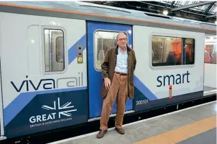  ?? PAUL BICKERDYKE ?? Adrian Shooter with his battery-powered EMU No. 230001 at Glasgow Central on October 29, 2021.