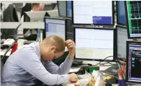  ?? AFP ?? Russian stock markets plunged 8 per cent and the rouble tanked 5 per cent against the US dollar in a single session last week. —