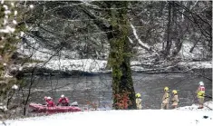  ??  ?? Rescue workers search for John James RitchieWil­son in the River Wear in Bishop Auckland