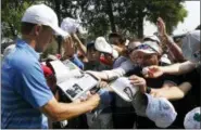  ?? MARCO UGARTE — THE ASSOCIATED PRESS ?? Jordan Spieth signs autographs for fans during after a practice round of the Mexico Championsh­ip, at the Chapultepe­c Golf Club in Mexico City, Wednesday.