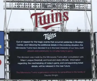  ?? ap; rIGHT, GeTTy IMaGes ?? BIGGER THAN BASEBALL: The scoreboard at Target Field in Minneapoli­s explains to fans that Monday’s game between the Red Sox and Twins has been postponed due to ongoing protests, right, after another Black man, Daunte Wright, was killed by police during a traffic stop.