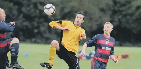  ??  ?? Ivy Legends (yellow) and Boldon Colliery battle for the ball.