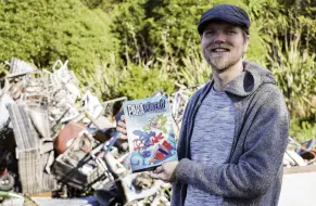  ?? PHOTO: SUPPLIED ?? Birdbraine­d . . . Former Alexandra man Book (Sam) Ruffell with his graphic novel, which is being released next week. The Dunedin rubbish dump and the pukeko which live there were his inspiratio­n.