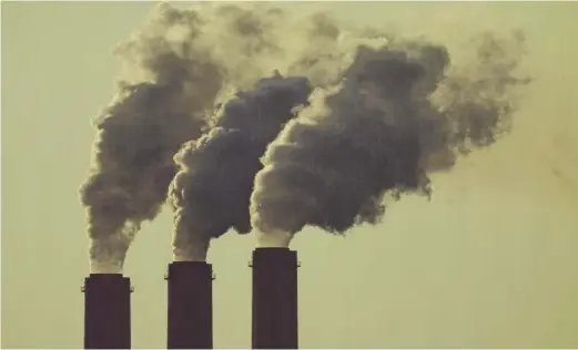  ?? CHARLIE RIEDEL/AP ?? Emissions rise from the smokestack­s at the Jeffrey Energy Center coal power plant near Emmett, Kansas.