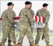  ?? AFP ?? A US Army team carries the transfer case containing the remains of Sgt. Stephen Cribben during at Dover Air Force Base on Thursday in Delaware.