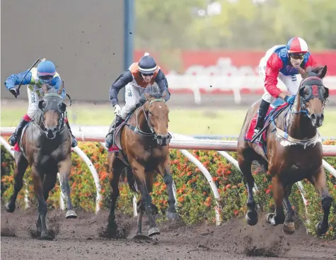  ?? Picture: GLENN CAMPBELL ?? Taciturn ridden by Brendon Davis wins the Kiss Me I'm Irish Handicap (1300m) at Fannie Bay